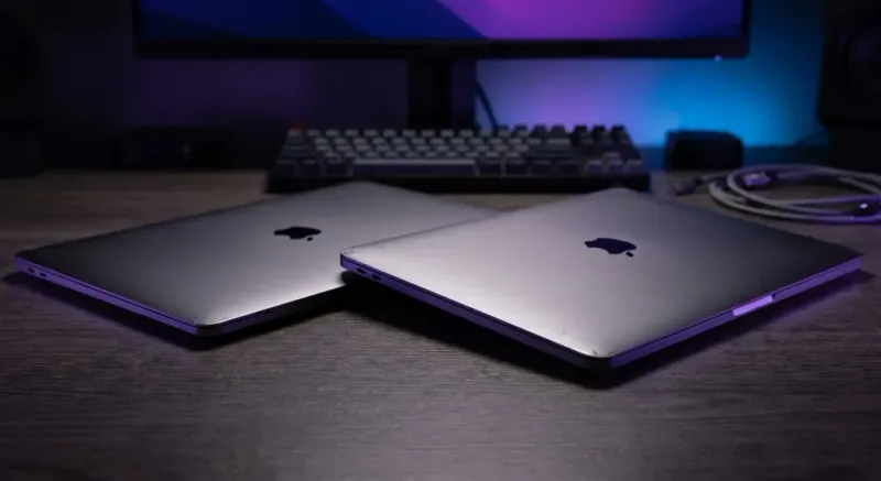Refurbished Macbook laptop on desk showing screen and keyboard detail